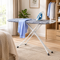 Foldable ironing board with a padded cover