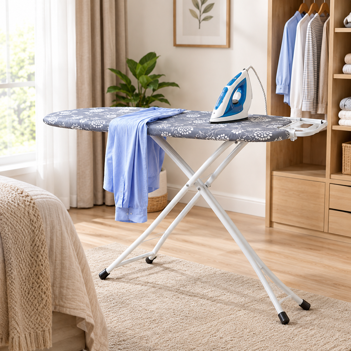 Foldable ironing board with a padded cover