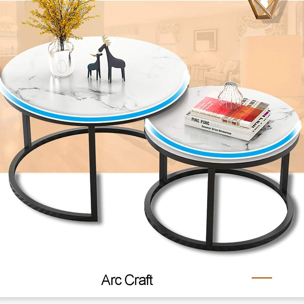 Two-piece nesting round table with a marble top and black metal frame