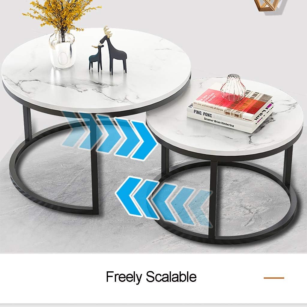 Two-piece nesting round table with a marble top and black metal frame