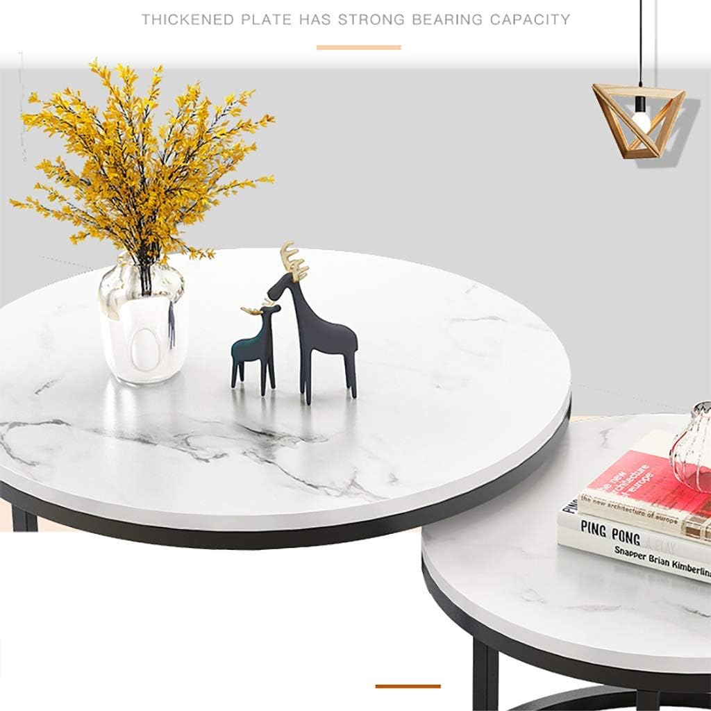 Two-piece nesting round table with a marble top and black metal frame