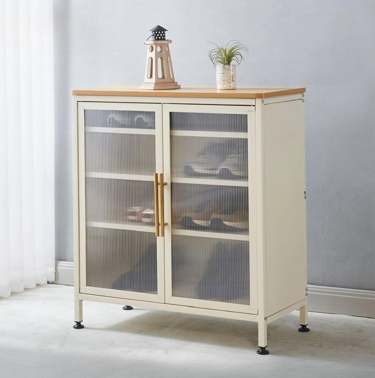 Modern off-white storage cabinet with two doors and gold handles