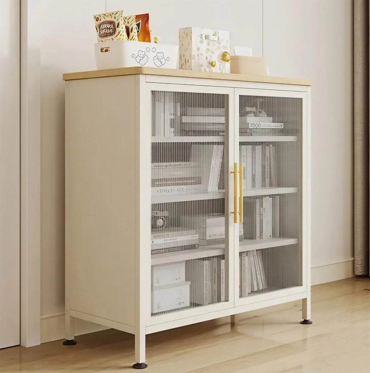 Modern off-white storage cabinet with two doors and gold handles